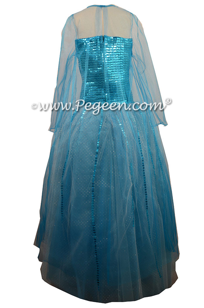 Turquoise Silk and Tulle with a Sequin Bodice, Glitter Mesh Sleeves and Cape with Multi Layered Colors of Tulle.  Silk Style 908 Flower Girl Dresses called Blue Diamond Elsa Dress