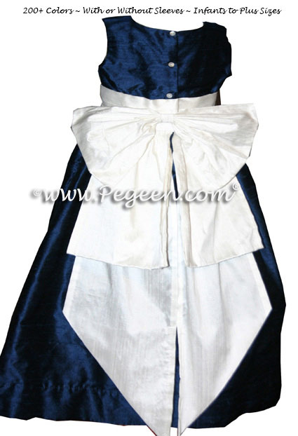 Flower girl dress in navy blue and ivory sash