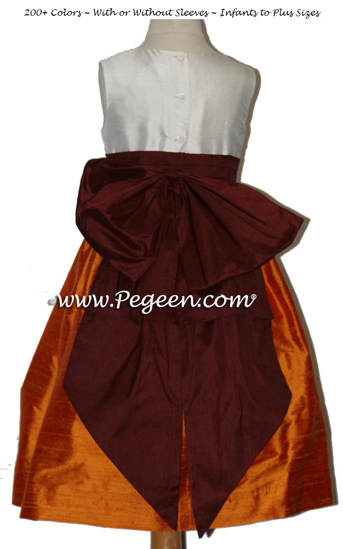 Flower girl dresses in Burgundy red and Mango Orange silk | Pegeen