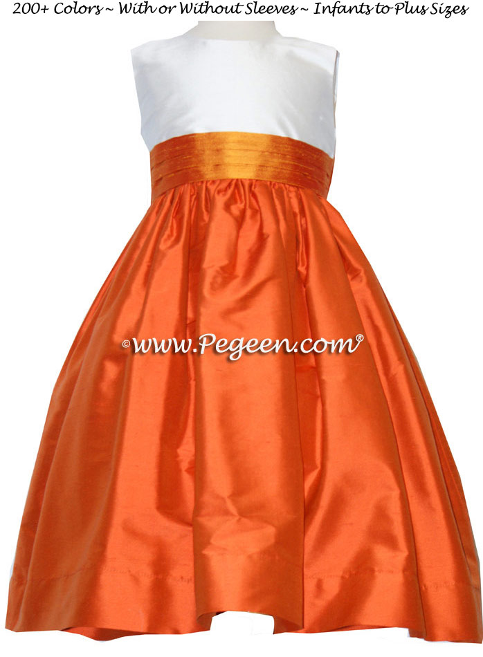 Carrot Orange, Antique White and Tangerine flower girl dresses by Pegeen