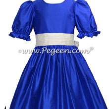 Style 398 flower girl dress in sapphire blue with an antique white silk sash