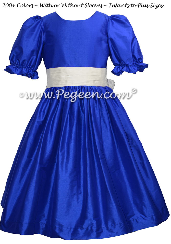 Style 398 flower girl dress in sapphire blue with an antique white silk sash