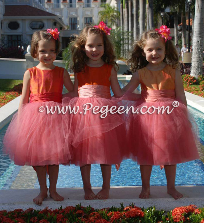 Tulle flower girl dresses in mango orange and coral pink