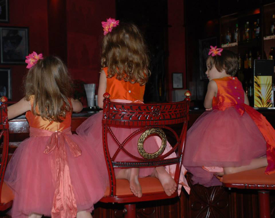 Tulle flower girl dresses in mango orange and coral pink