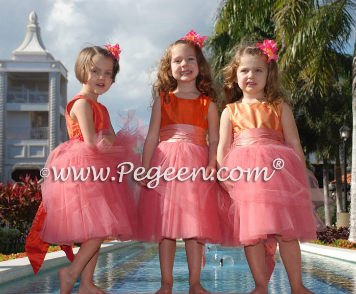 Tulle flower girl dresses in mango orange and coral pink