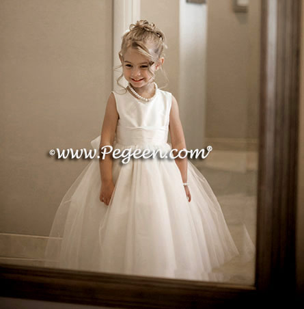Custom flower girl dresses with layers and layers of tulle and beautiful flowers made from real silk