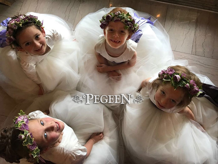 This bride chose various shades of lavender to accent her flower girls' white silk tulle dresses