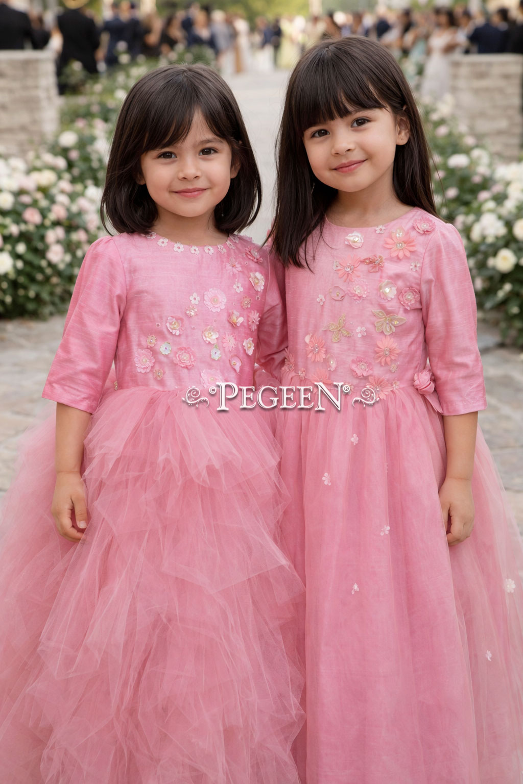 Rose and coral shades of tulle and appliqued bodice on flower girl dress