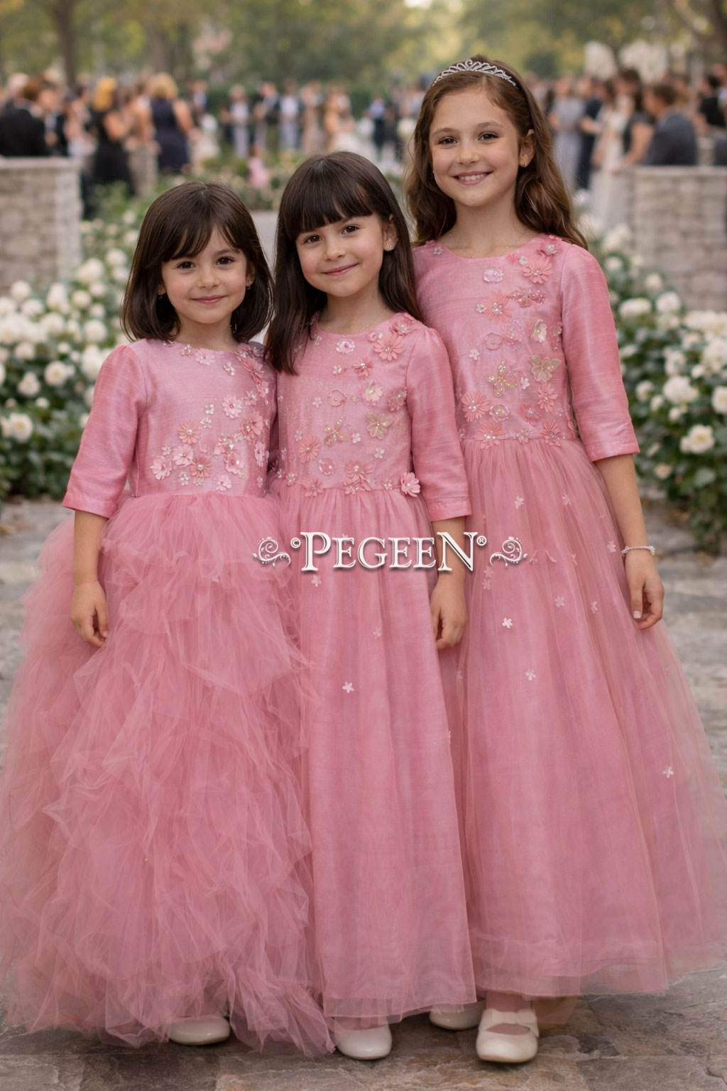 Rose and coral shades of tulle and appliqued bodice on flower girl dress