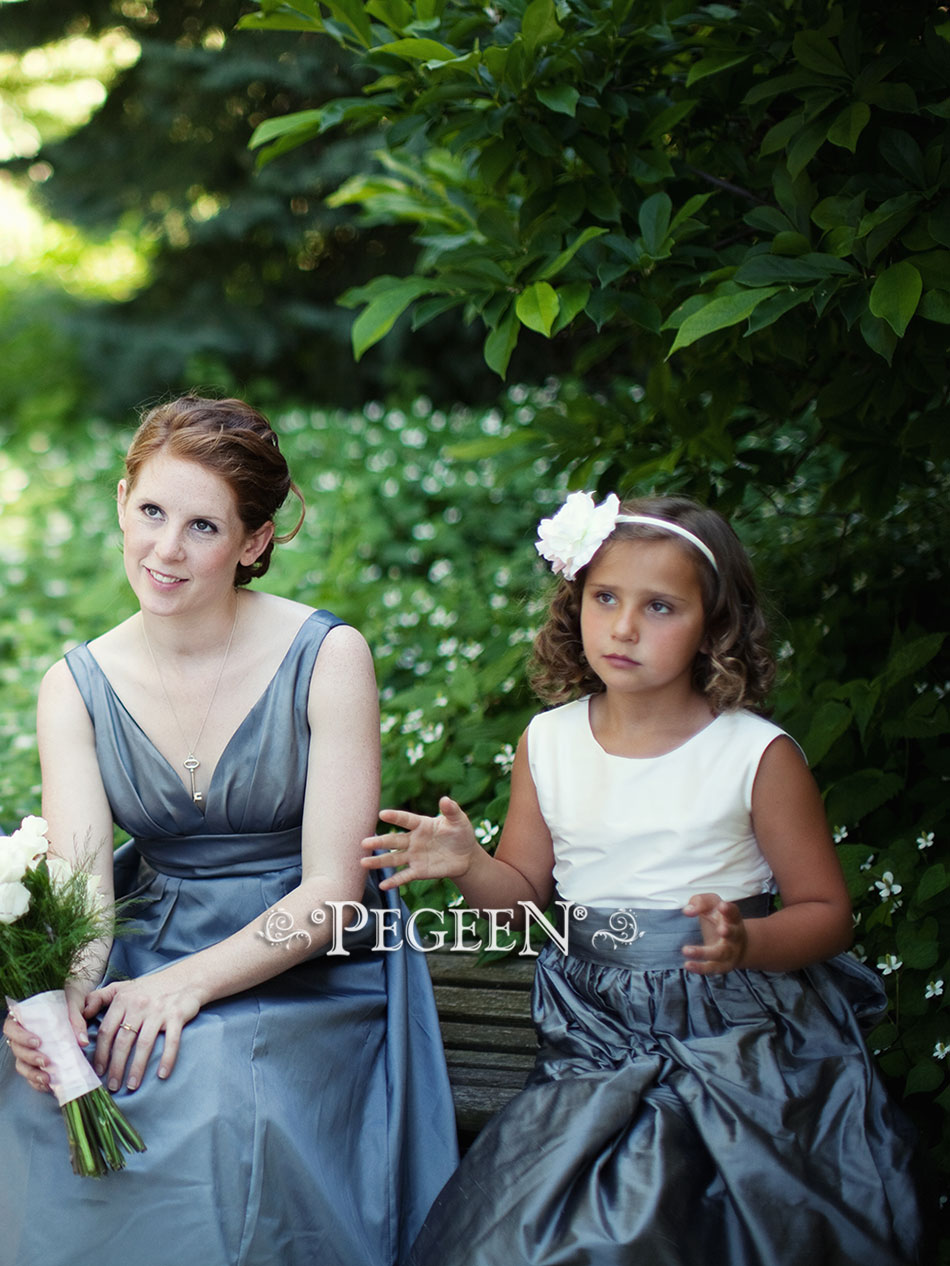 The bride chose Medium Gray and Antique White silk for her flower girl dress in style 398