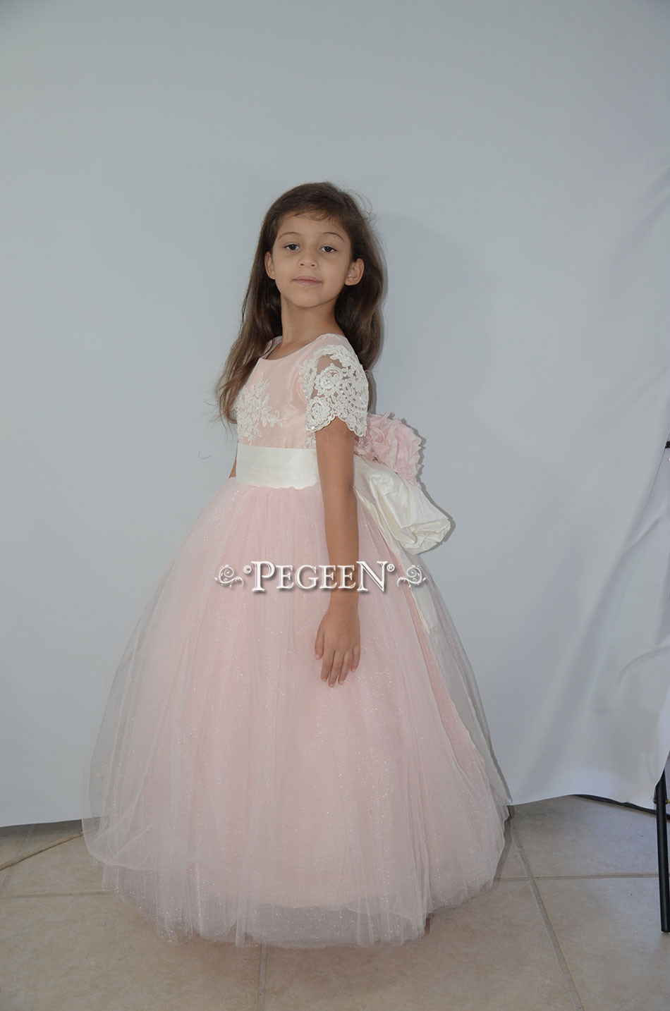 Flower Girl Dress with pink aloncon lace and Signature Bustle