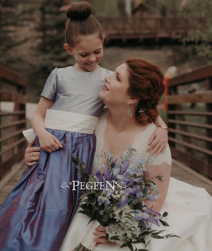 Lavender and razzleberry silk flower girl dress with ivory sash