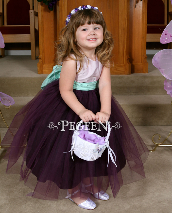 Plum, light orchid and aqua accents are sweet on this little girl's flower girl dress