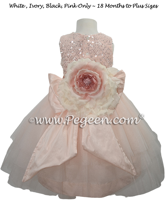 Pink sequinned tulle flower girl dress with handmade flower