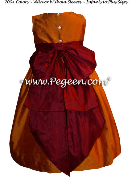 Deep cranberry and pumpkin Flower Girl dresses by PEGEEN Style 345