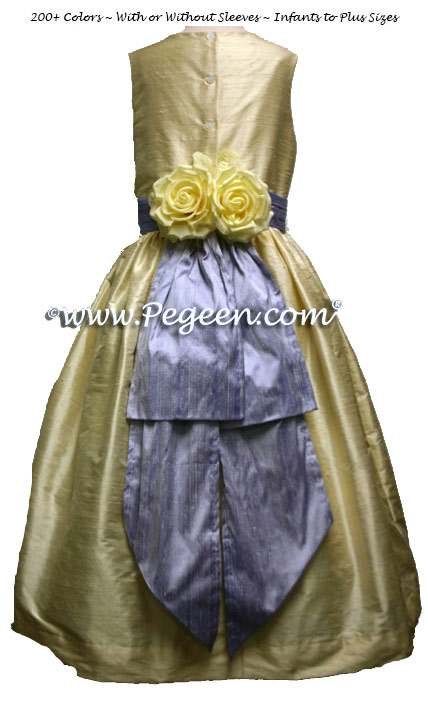 Lilac and buttercream silk flower girl dresses with yellow back flowers