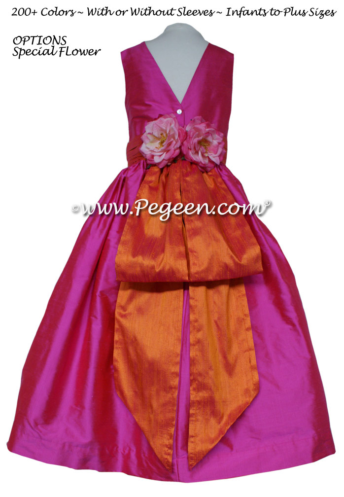 Shock (hot pink) and Mango (orange) silk flower girl dresses with handmade silk flowers