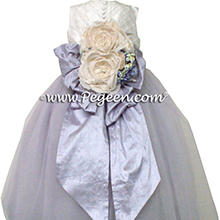 Custom silk couture flower girl dress with light orchid bustle and tulle skirt