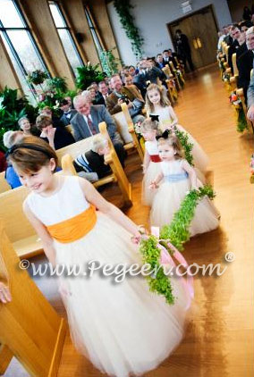 Beautiful tulle flower girl dresses in creme, ivory and colors by Pegeen.com