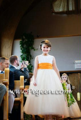 Couture ivory and orange tulle flower girl dresses by Pegeen