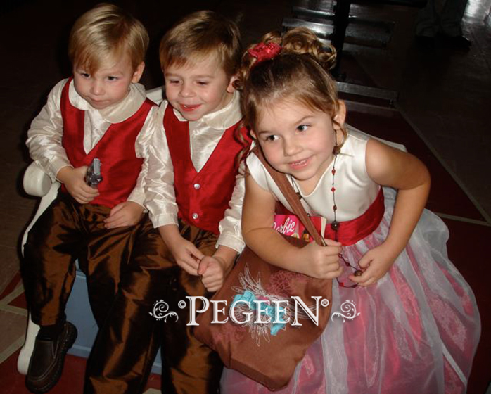 Red and creme flower girl dresses with matching silk ring bearer suits