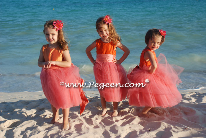 Tulle flower girl dresses in mango orange and coral pink