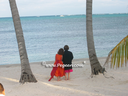 Orange and hot pink flower girl dresses in Belize