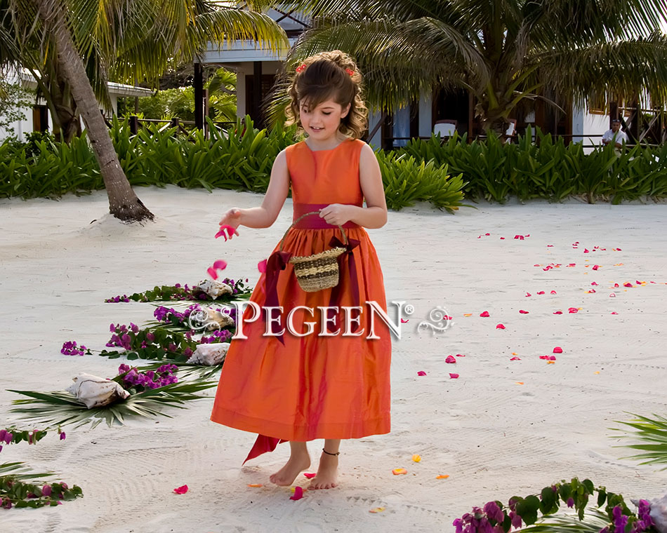 Custom flower girl dress at a beach wedding in squash and sorbet pink
