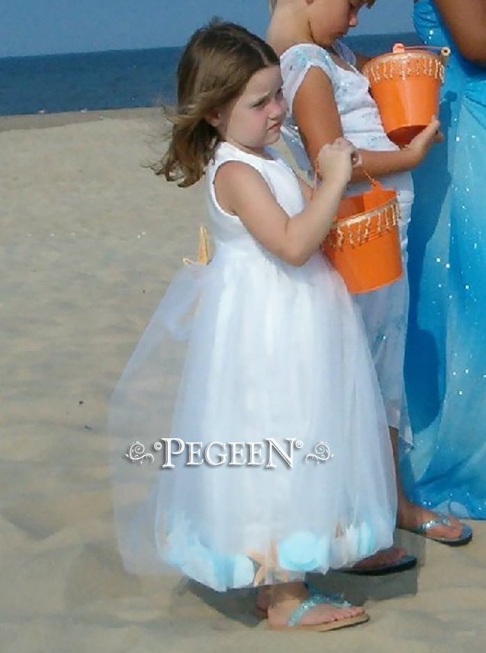 Beach Wedding with aqua tulle and sea shells in skirt