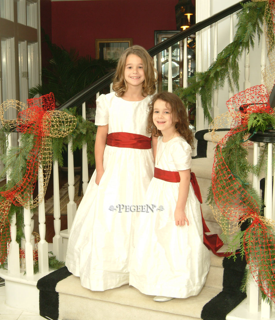 Ivory and red Christmas flower girl dresses by Pegeen